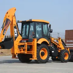 Pomarańczowa koparko-ładowarka ACE M-124 Digmaster. Szukasz idealnej koparko ładowarki do 50 tys.? Ten model może być odpowiedzią.